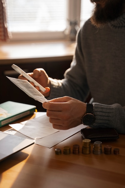 A person reviewing tax forms and financial documents on a desk, with a calculator and pen in hand, emphasizing the importance of understanding income limitations for claiming the AOTC.