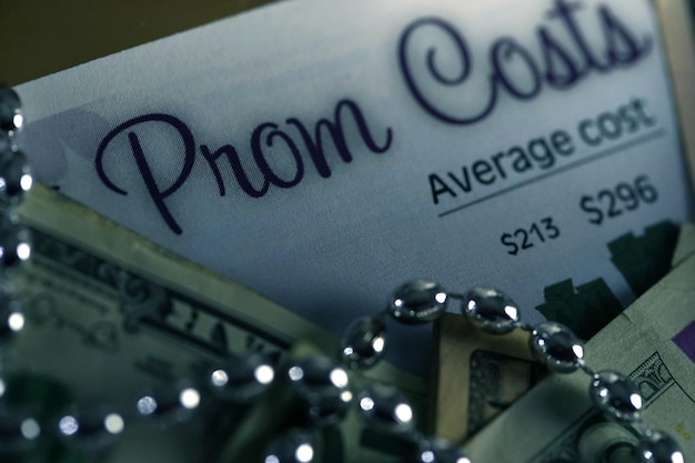 A close-up of a financial aid award letter with key figures highlighted, showing the cost of attendance, grants, loans, and the remaining balance needed.