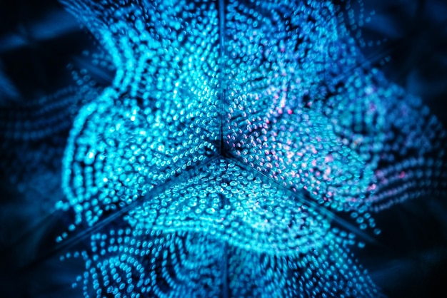 A close-up of a silicon chip with intricate patterns, illuminated by soft blue light. Small, stylized icons representing various industries (healthcare, finance, transportation) are projected onto the chip's surface.