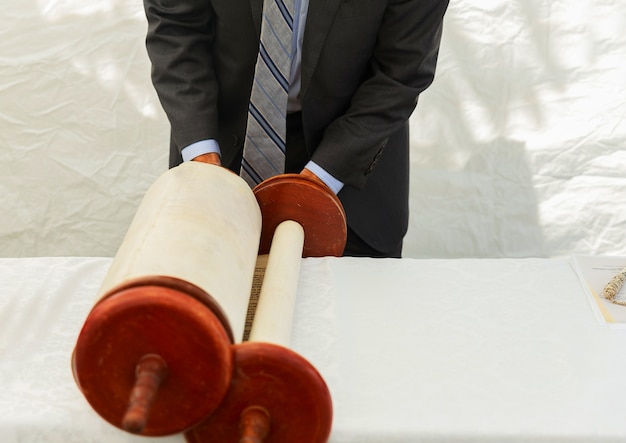 A close-up shot of a gavel hitting the block at an art auction, capturing the intensity and anticipation of the auction process. The background should be blurred, focusing on the gavel and the auctioneer's hands.