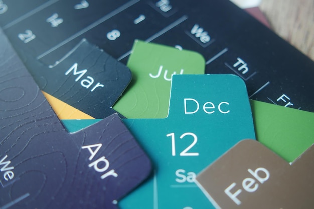 A close-up of a calendar highlighting various dates, specifically emphasizing application deadlines and project timelines related to federal grants. The image includes pens, notepads, and other organizational tools, suggesting the importance of planning and preparation.