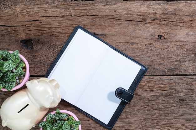 A close-up photo of an open Social Security Administration handbook on a wooden table, with a pen resting on top, emphasizing the importance of understanding the application process.