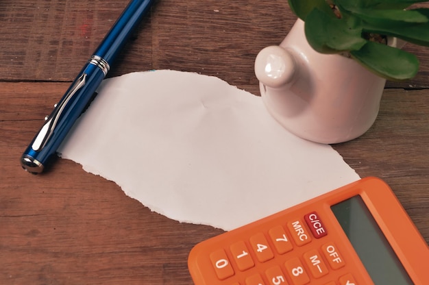 A close-up of a tax form (Form 8863) with a calculator and pen, emphasizing the process of calculating and claiming the Lifetime Learning Credit.