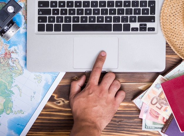 An image of Form 8863 with a hand pointing to the section for the Lifetime Learning Credit, along with a laptop displaying tax software.