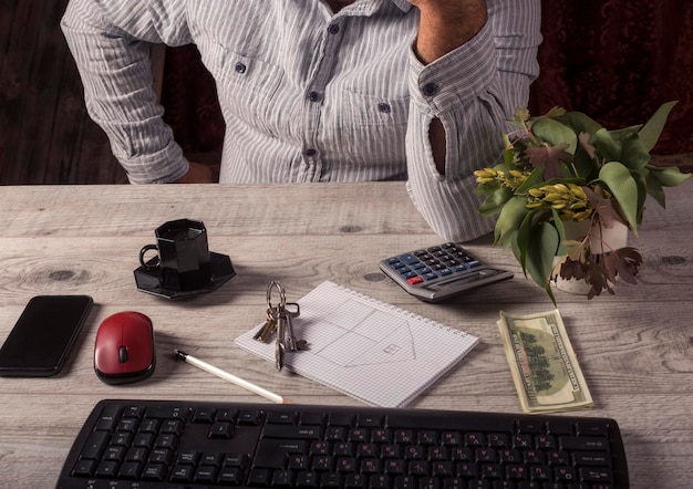 An employer reviewing a WOTC application form at their desk, surrounded by documents and a calculator, focusing on maximizing their potential tax credits.