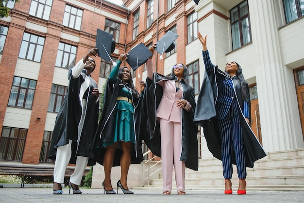 A diverse group of college students celebrating their graduation, tossing their caps in the air. The image conveys a sense of accomplishment and the potential for a bright future, emphasizing the importance of financial aid in making higher education accessible.