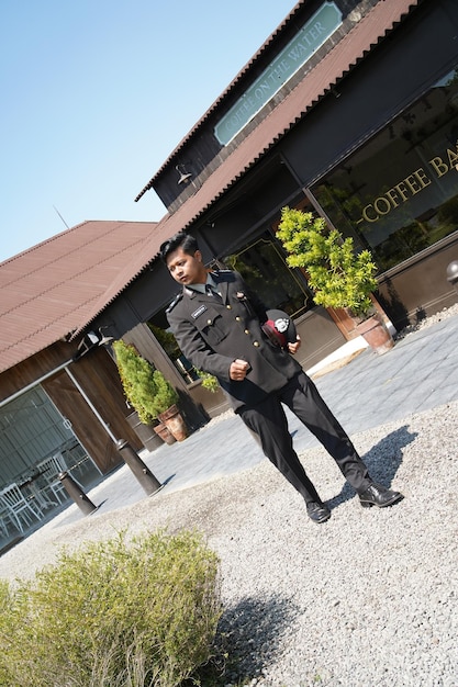 A uniformed JAG officer standing in front of a military courthouse, symbolizing the intersection of law and military service and the potential for loan repayment benefits.