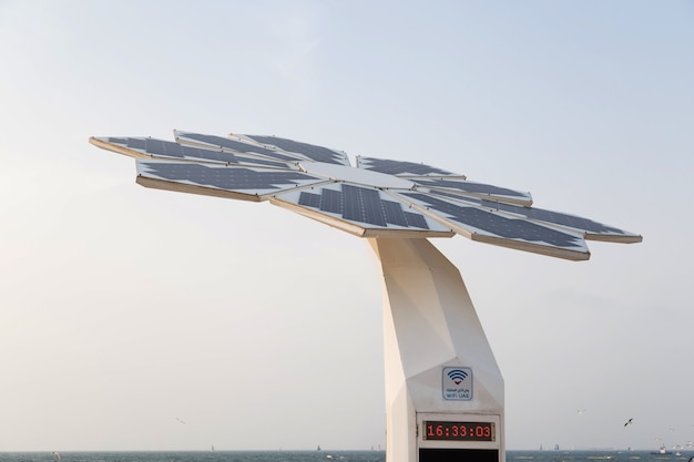 A collection of diverse solar panels on a rooftop, showcasing different technologies and brands.