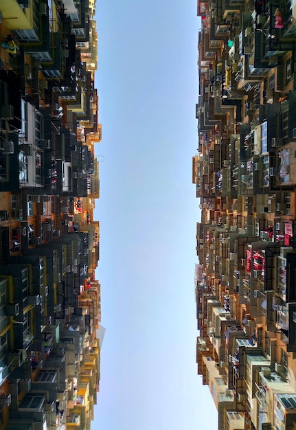 A split-screen image showing contrasting scenarios: on one side, a prosperous cityscape with rising stock charts representing a bull market, and on the other side, a cityscape under stormy weather with falling stock charts representing a bear market, symbolizing the potential impact of interest rate decisions.