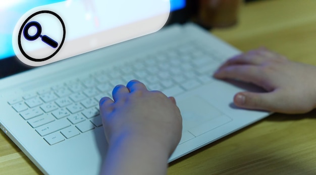 A close-up of a hand clicking a search button on a laptop, with the Grants.gov website visible in the background, highlighting the importance of digital research in finding grant opportunities.