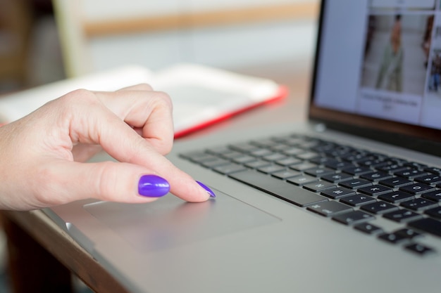 A close-up of the FAFSA application form on a laptop screen, highlighting sections with simplified language and clear instructions. Hands are visible, gently navigating the form.