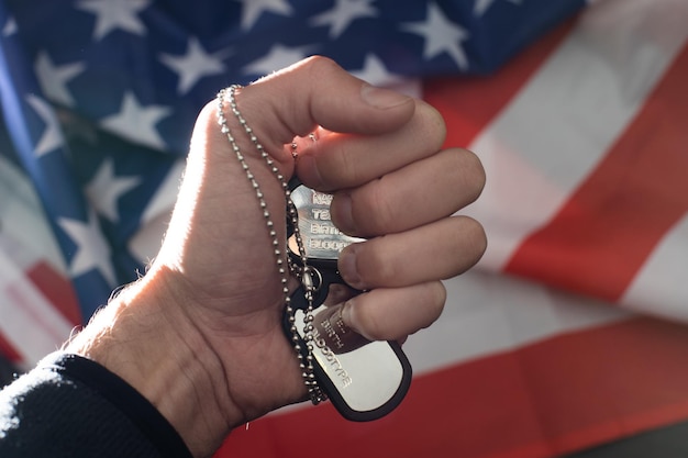 A photograph of a US military veteran receiving keys to a new home from a real estate agent, symbolizing the benefits of VA loans for veterans.