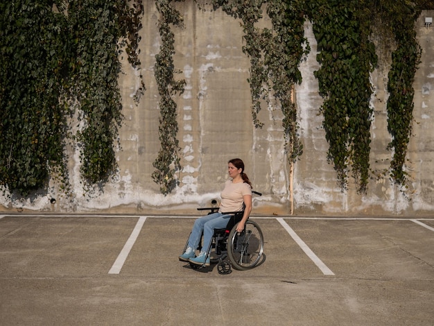A person using a wheelchair is shown confidently navigating a city street with accessible sidewalks and ramps. The image emphasizes independence and accessibility in urban environments.