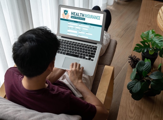 A person using a laptop to search for mental health treatment facilities online. The screen displays a map with highlighted locations of nearby treatment centers. A supportive hand is placed gently on the person's shoulder.