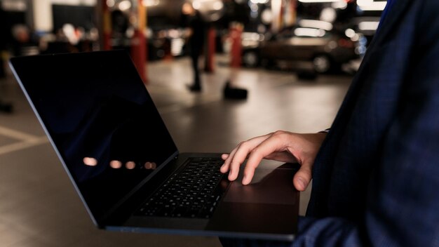 A close-up shot of hands typing on a laptop, with a blurred US government building in the background. The scene focuses on the digital aspect of accessing government resources for small businesses, emphasizing online applications and research.
