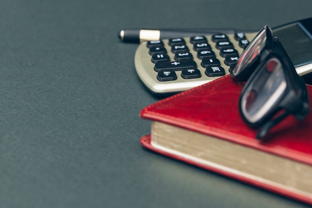 A close-up shot of a tax form being filled out, with a calculator and pen nearby. The focus is on the section related to education tax credits and deductions.