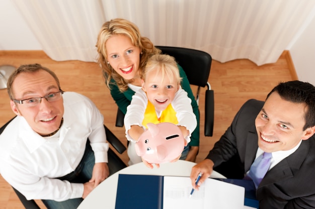 A happy family with children, with the parents smiling and holding hands, superimposed on a background of tax forms and financial documents.