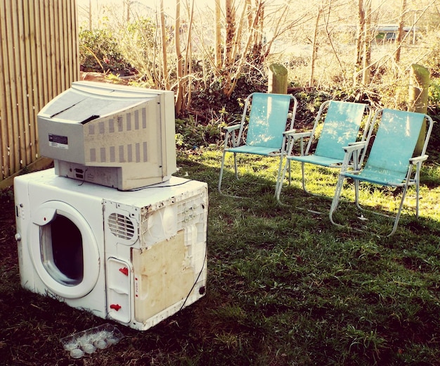 A split image comparing an old, inefficient appliance (e.g., refrigerator or air conditioner) with a new, Energy Star certified model. Focus on the energy consumption difference displayed on the appliance labels.