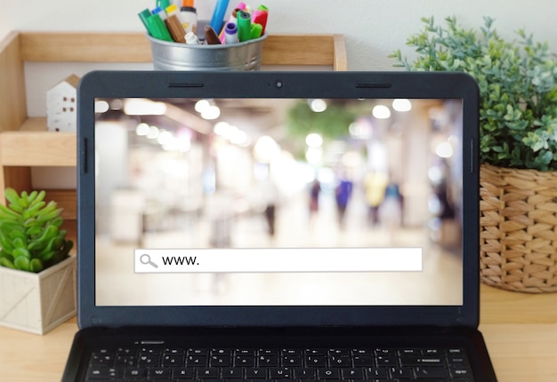 A close-up shot of a laptop screen displaying the FAFSA website. The focus is on the form fields and the instructions, with a hand hovering over the keyboard, ready to input information or navigate the site.