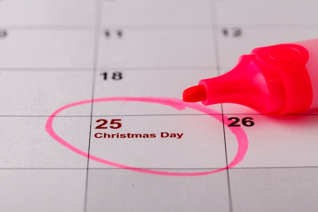 Close-up of a calendar with a circle around a date labeled 