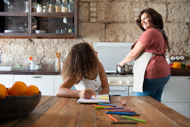 A close-up of a parent helping their child with homework at a kitchen table, highlighting the impact of tax credits on family life and educational opportunities. Sunlight streams through the window, creating a warm and supportive atmosphere.