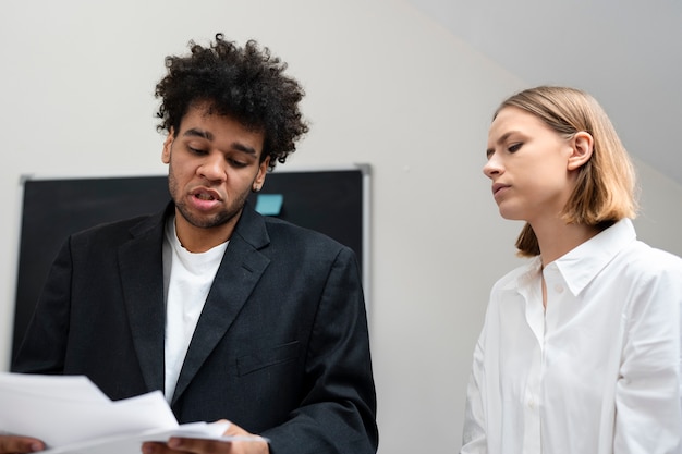 A career counselor reviewing job options with an unemployed person.